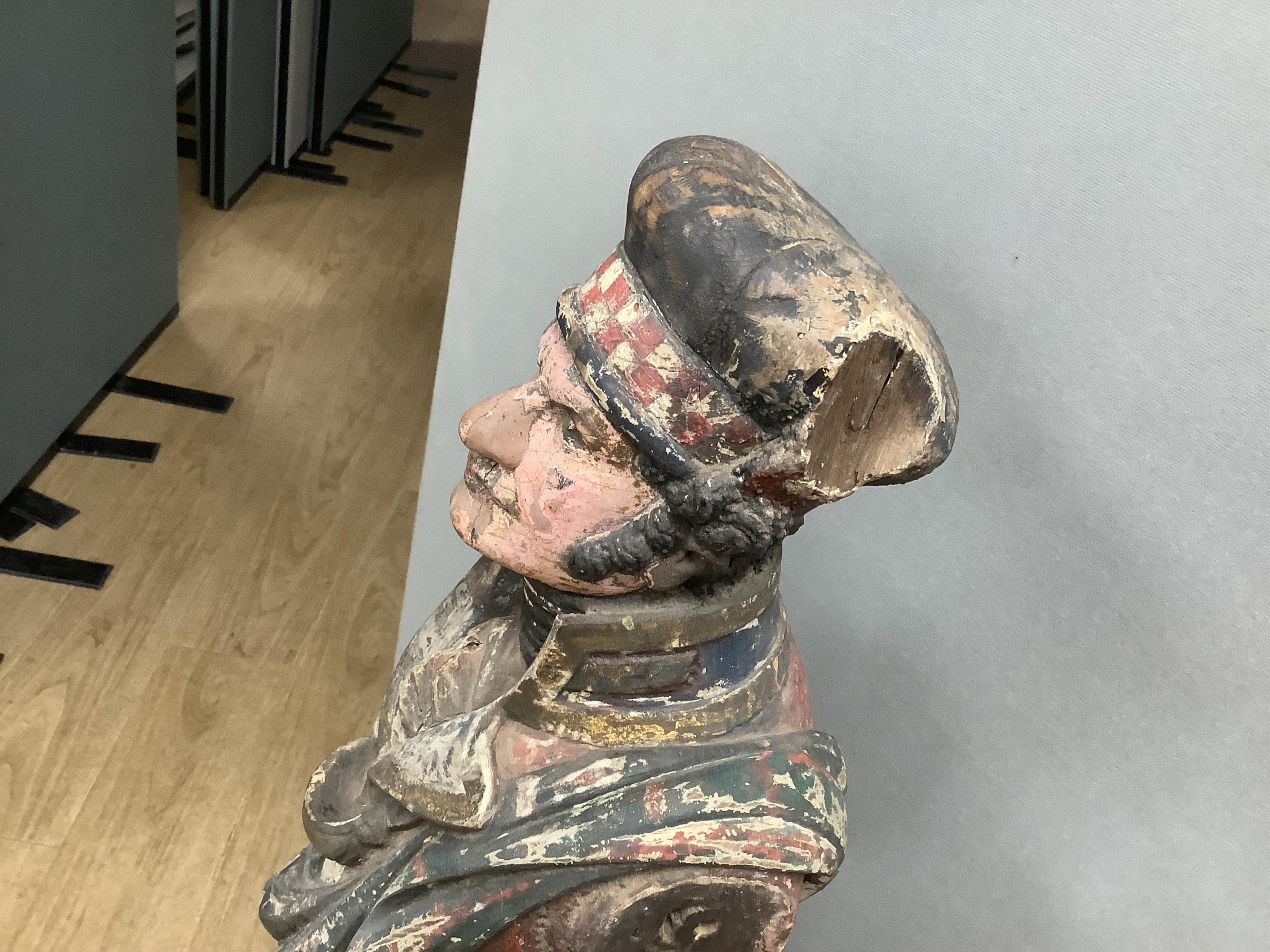 A large 19th century carved and painted Highlander ‘Snuff’ shop advertising figure. 109cm high. Condition - paint work and base weathered, arms detached.